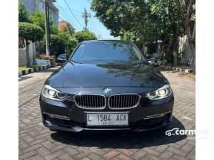 Jual bekas 2013 BMW 320i 2.0 Luxury Sedan hitam,lokasi di Jawa Timur