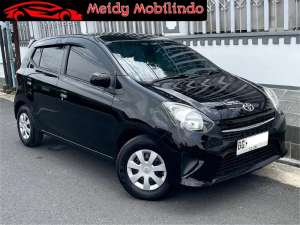 Jual bekas DP 18jt Agya 1.0 E Manual 2016 MT manual bot at top g irit sip 2015,lokasi di Palembang Kota