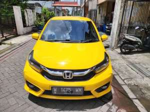 Jual bekas HONDA NEW BRIO 1.2 E MANUAL 2021 KUNING FACELIFT,lokasi di Surabaya Kota