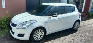 Jual bekas Suzuki Swift All New 4x2 Metik AT 2015 Putih Metalik,lokasi di Gowa Kab.