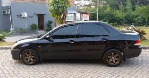 Mitsubishi Lancer 2004 Bensin lokasi di  , tersedia melalui melalui situs Olx